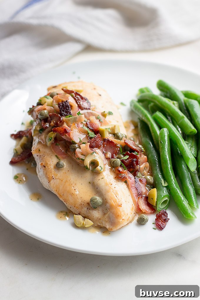 Chicken tapenade with a piquant sauce of bacon, caper, lemon, olives, and butter, shows low carb eating at it's best.