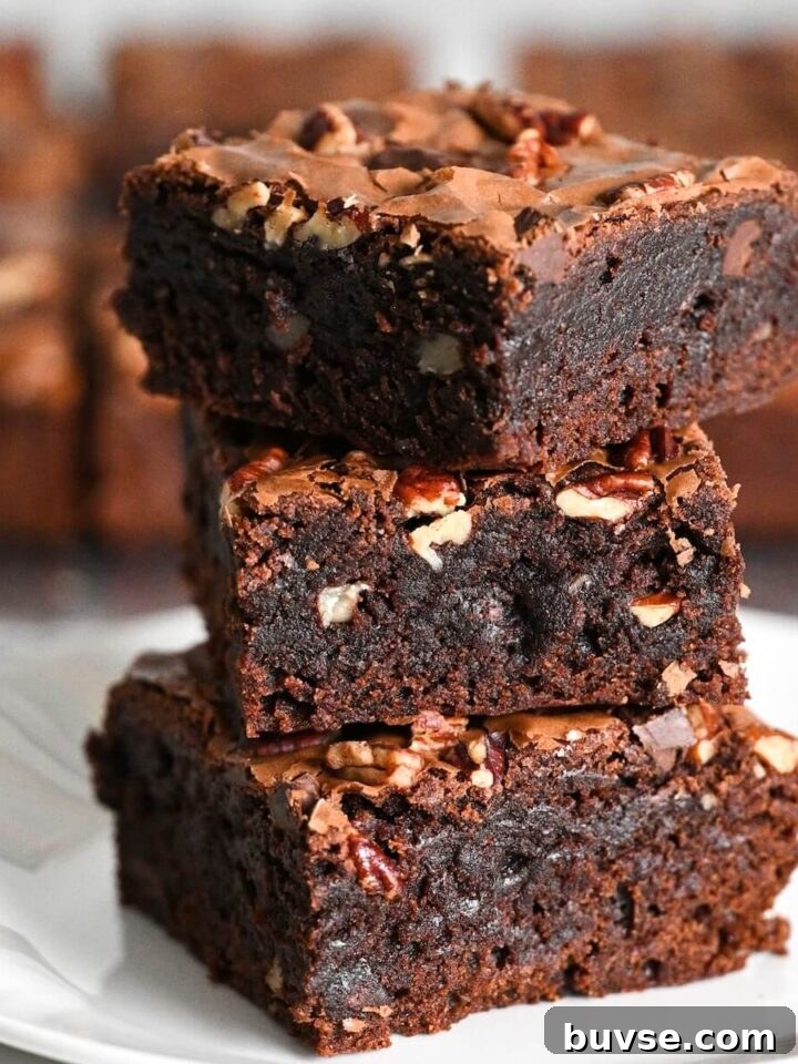 Moist Double Chocolate Chip Bundt Cake 10 stacked bakery style brownies made with boxed mix and special ingredients.