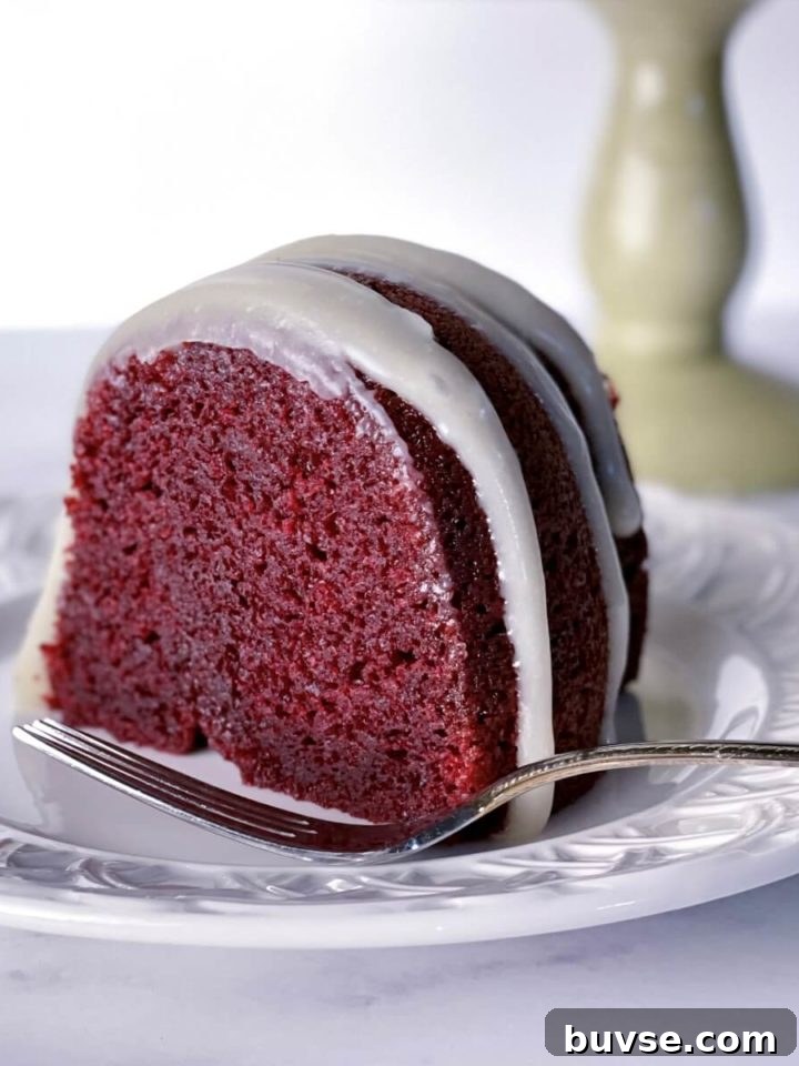 Moist Double Chocolate Chip Bundt Cake 11 A slice of deep red moist red velvet bundt cake with cream cheese glaze