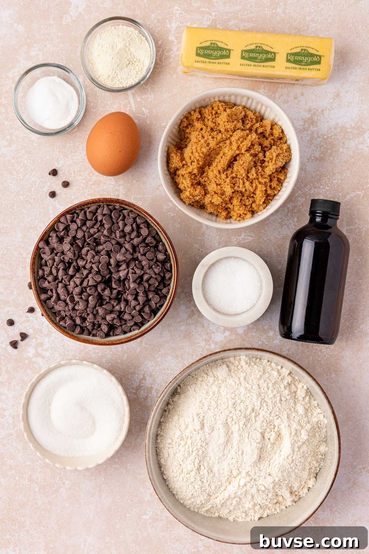 Ingredients to make chocolate chip cookies on a table.