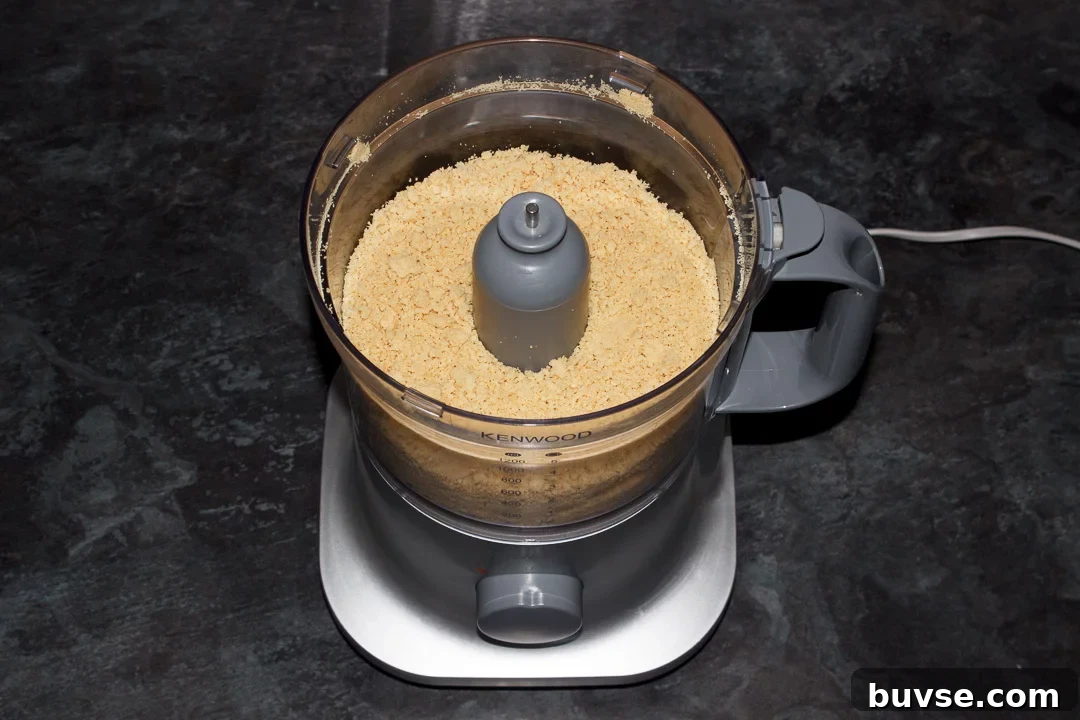 Crushed biscuit crumbs in a food processor