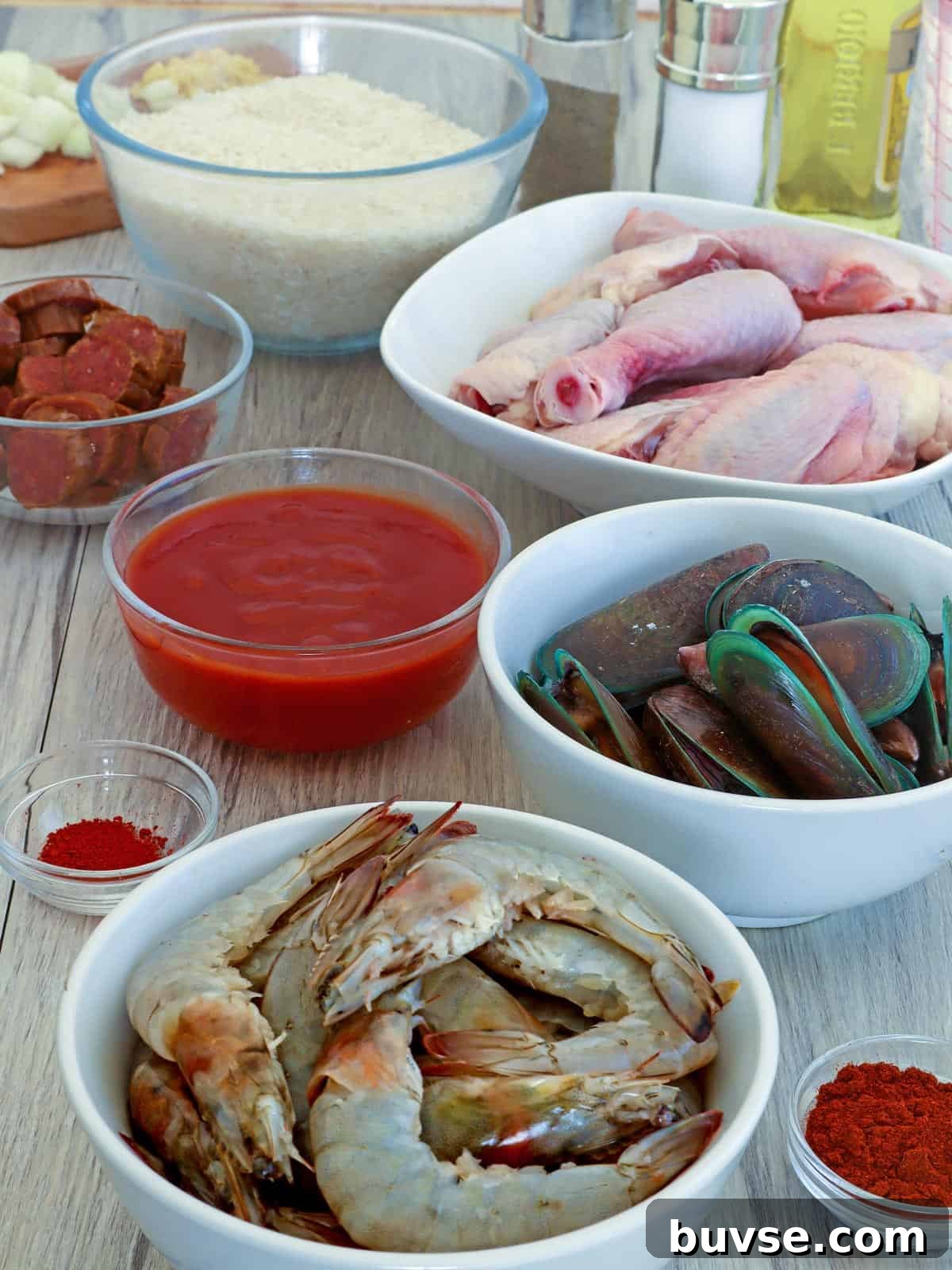 shrimp, rice, tomato sauce, mussels, chicken, sausage, paprika, saffron