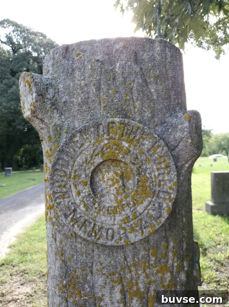 Woodmen of the World Symbol on ancestor's tombstone that looks like a tree trunk
