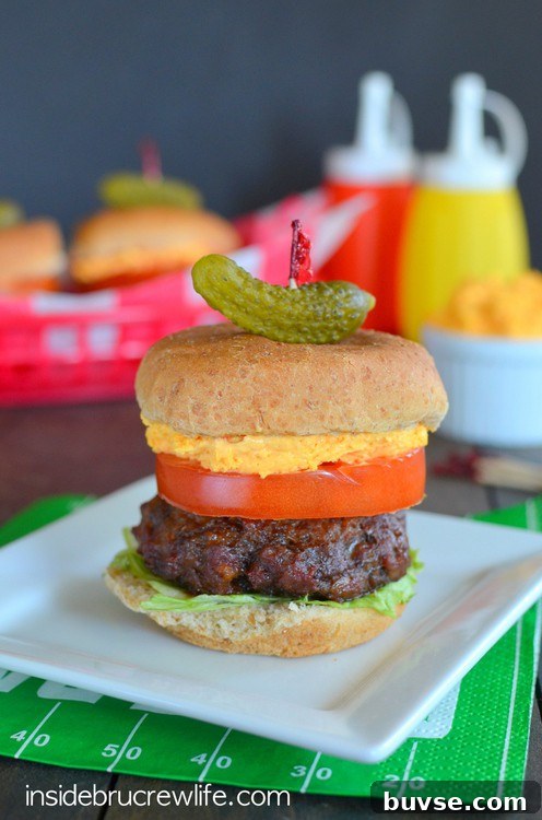 Cheese, bacon, and ranch added to beef makes the perfect mini slider for tailgating or grilling out parties.