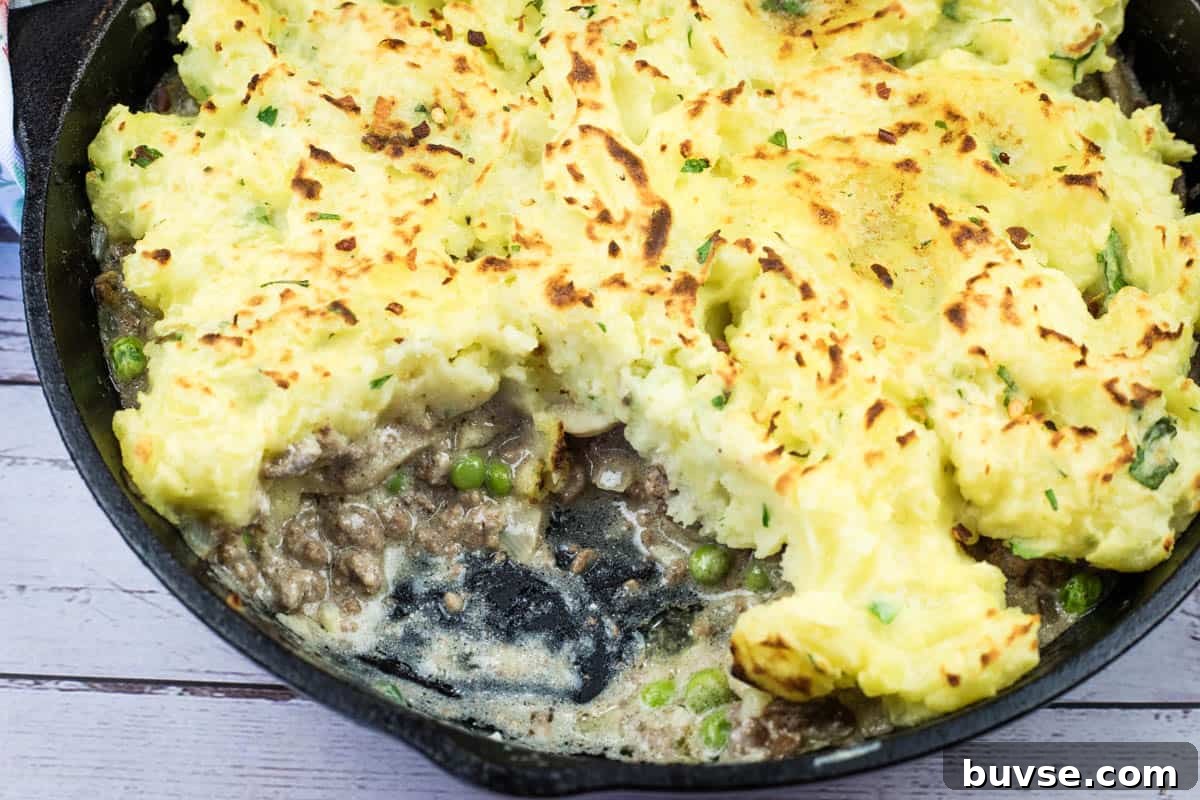 A Skillet Stroganoff Pie with a small missing portion.