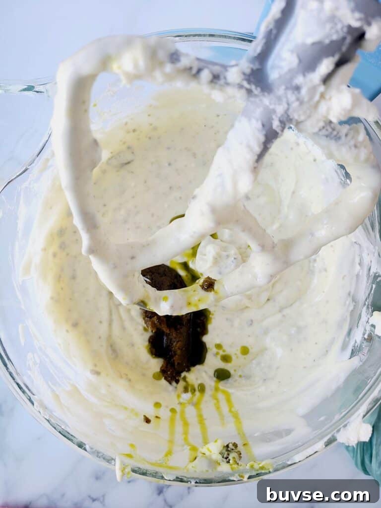 Adding pistachio paste into cheesecake batter