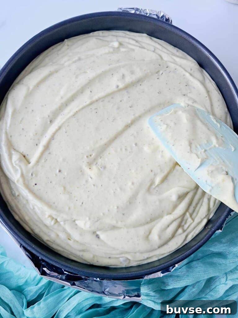 Smoothing cheesecake batter with spatula