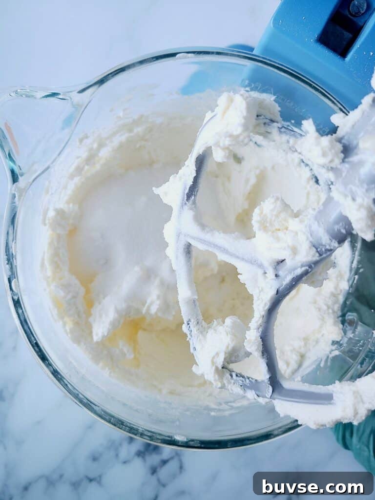 Mixing cream cheese with sugar