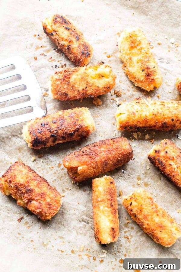 Crispy Potato Croquettes Recipe for Golden Homemade Bites 7 Crispy potato croquettes on a baking sheet. You can make the croquettes in an oven or fry them in a skillet.