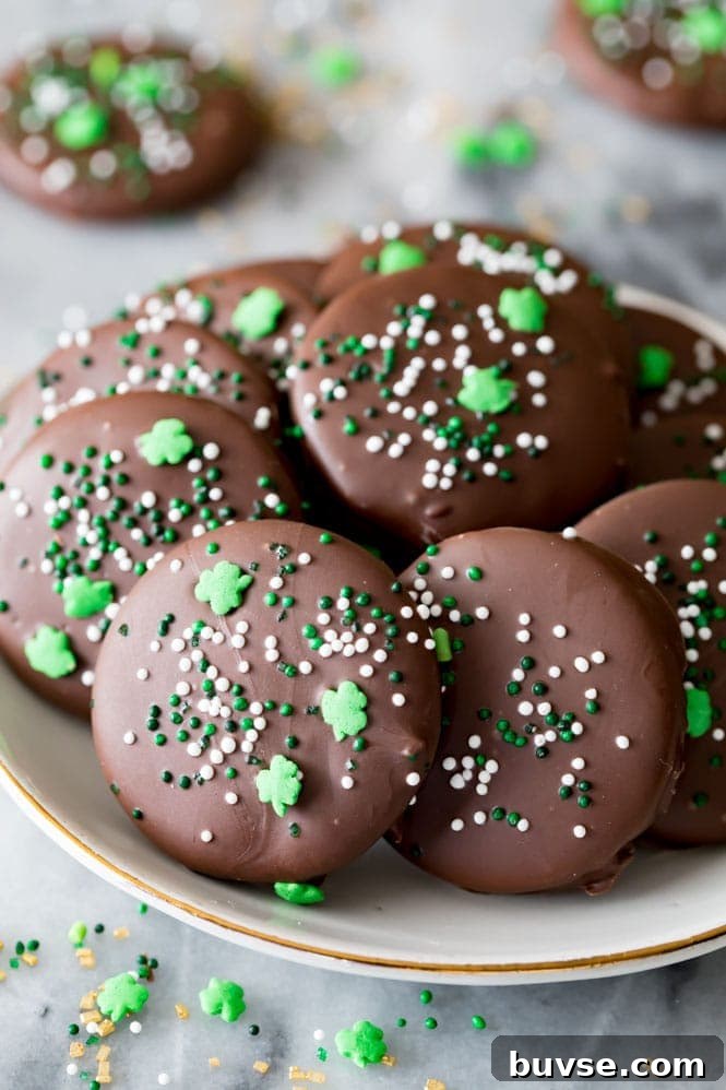 A plate full of copycat Thin Mint cookies decorated with festive St. Patrick's Day sprinkles