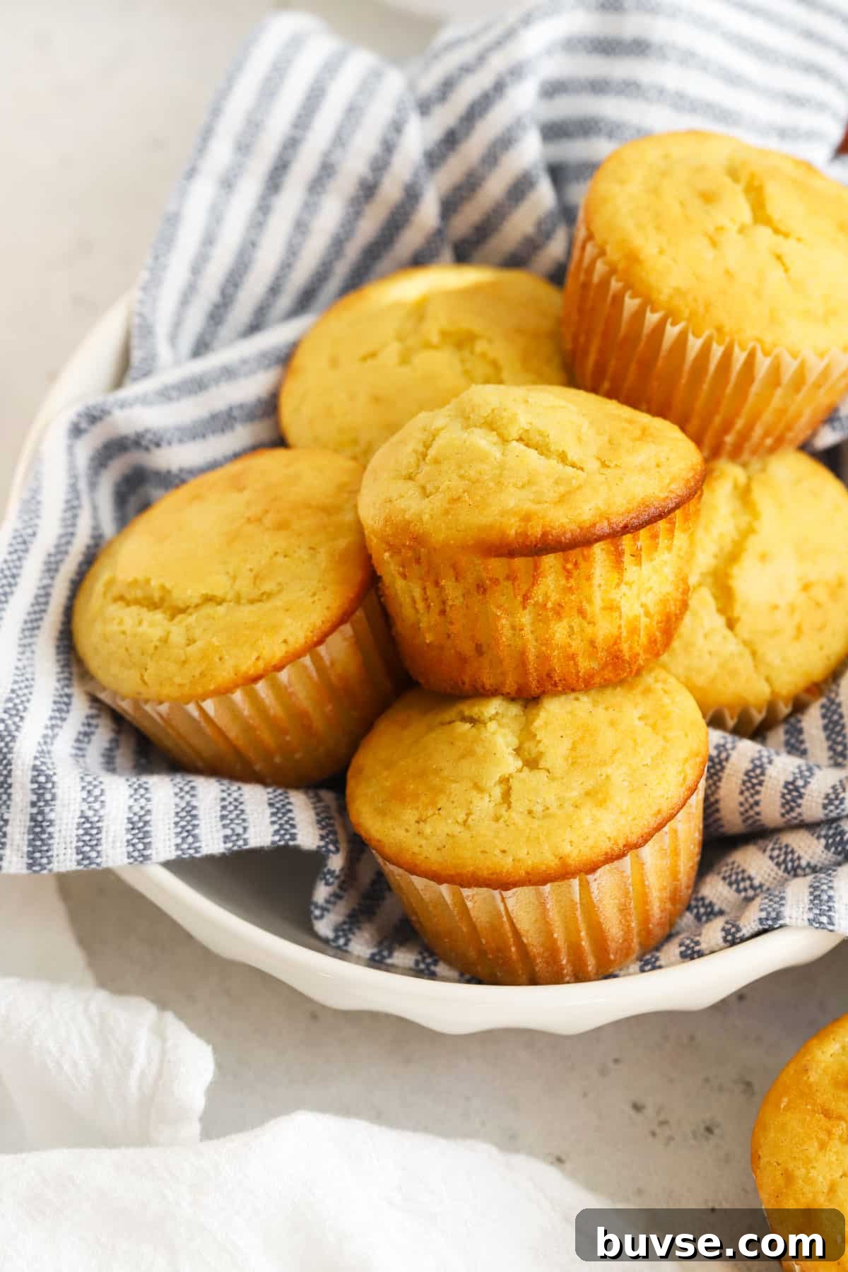 Moist Gluten-Free Corn Muffins with Crispy Tops 6 a basket of gluten-free corn muffins