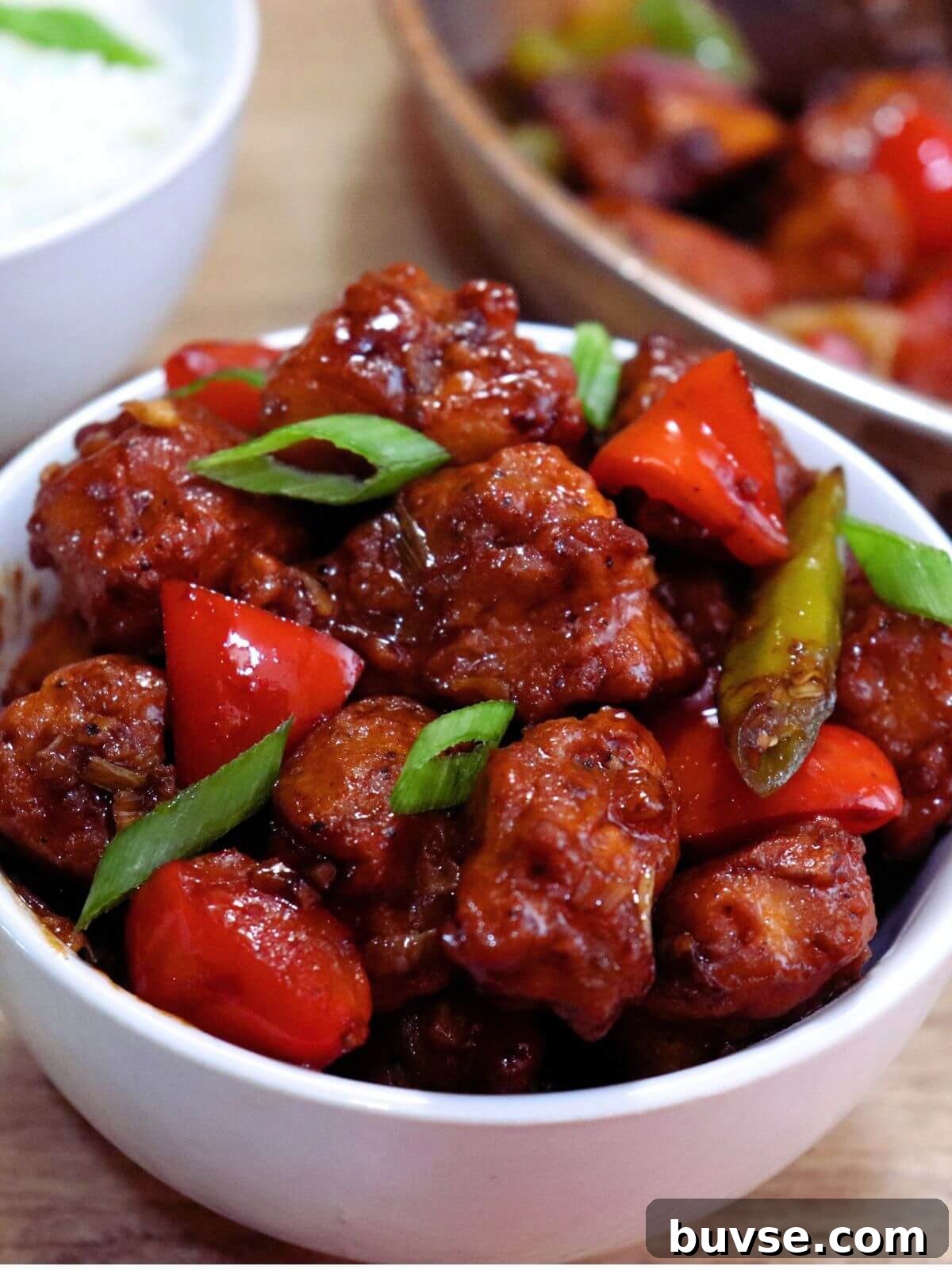Restaurant-Style Chilli Chicken Dry Recipe 2 tight close-up of chilli chicken served in a bowl.