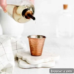 simple syrup in shot glass.