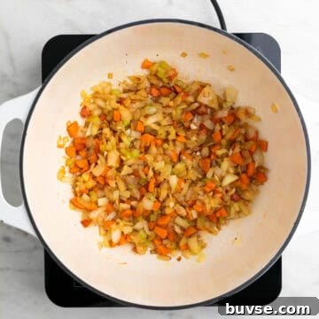 Onion, celery, carrot, and garlic sautéed in a large pot.