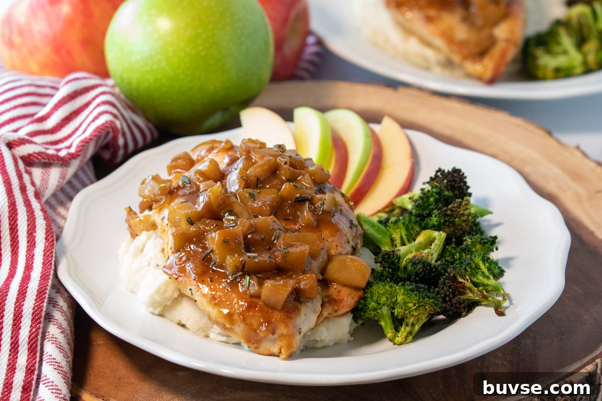 One-Pan Chicken in Apple Cider Sauce Recipe 8 plate of chicken with apple cider sauce, apple slices, and broccoli