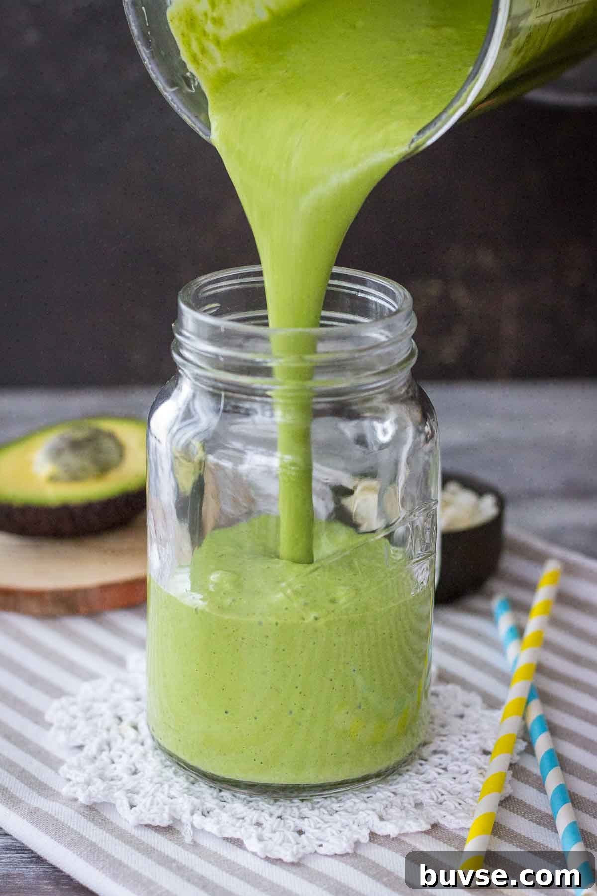 Matcha Protein Shake Recipe for Energizing Mornings 4 Pouring Matcha Protein Shake into glass