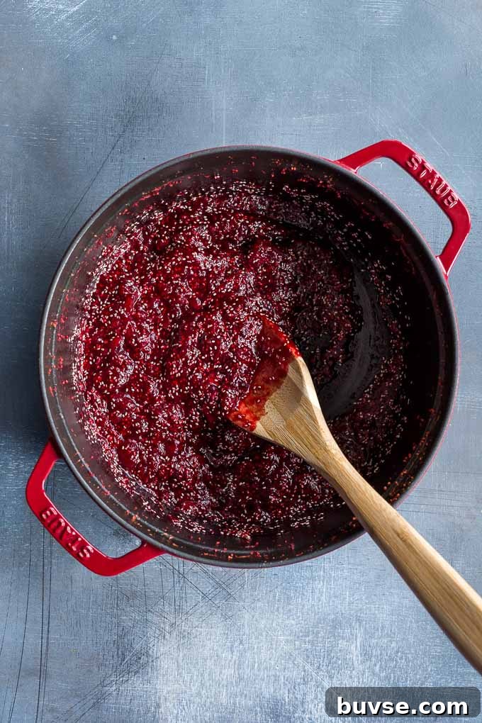Overhead view of healthy cranberry sauce in a large pot.