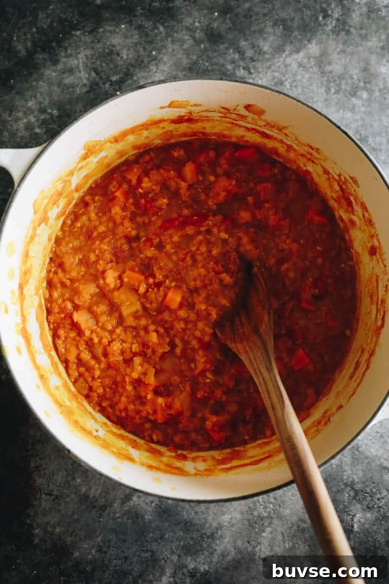 Cooked vegetable dal recipe in a white dutch oven