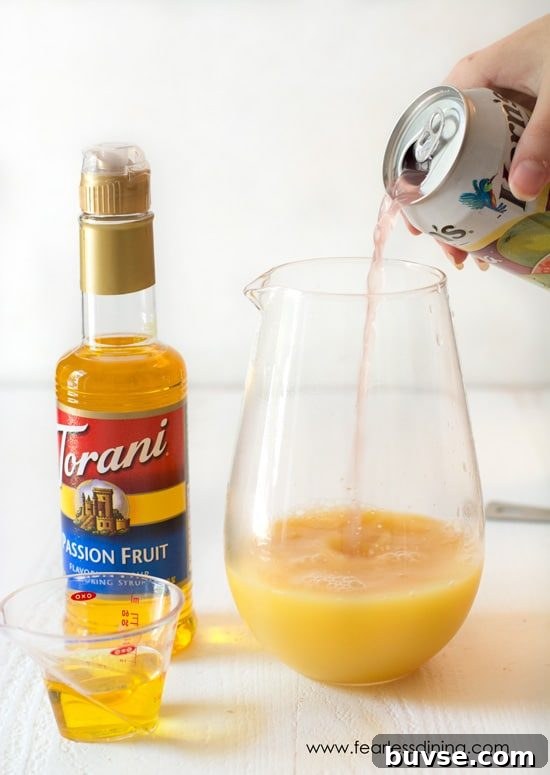 POG Cocktail Recipe: Passion Fruit, Orange and Guava 3 Pouring guava juice into the pitcher.