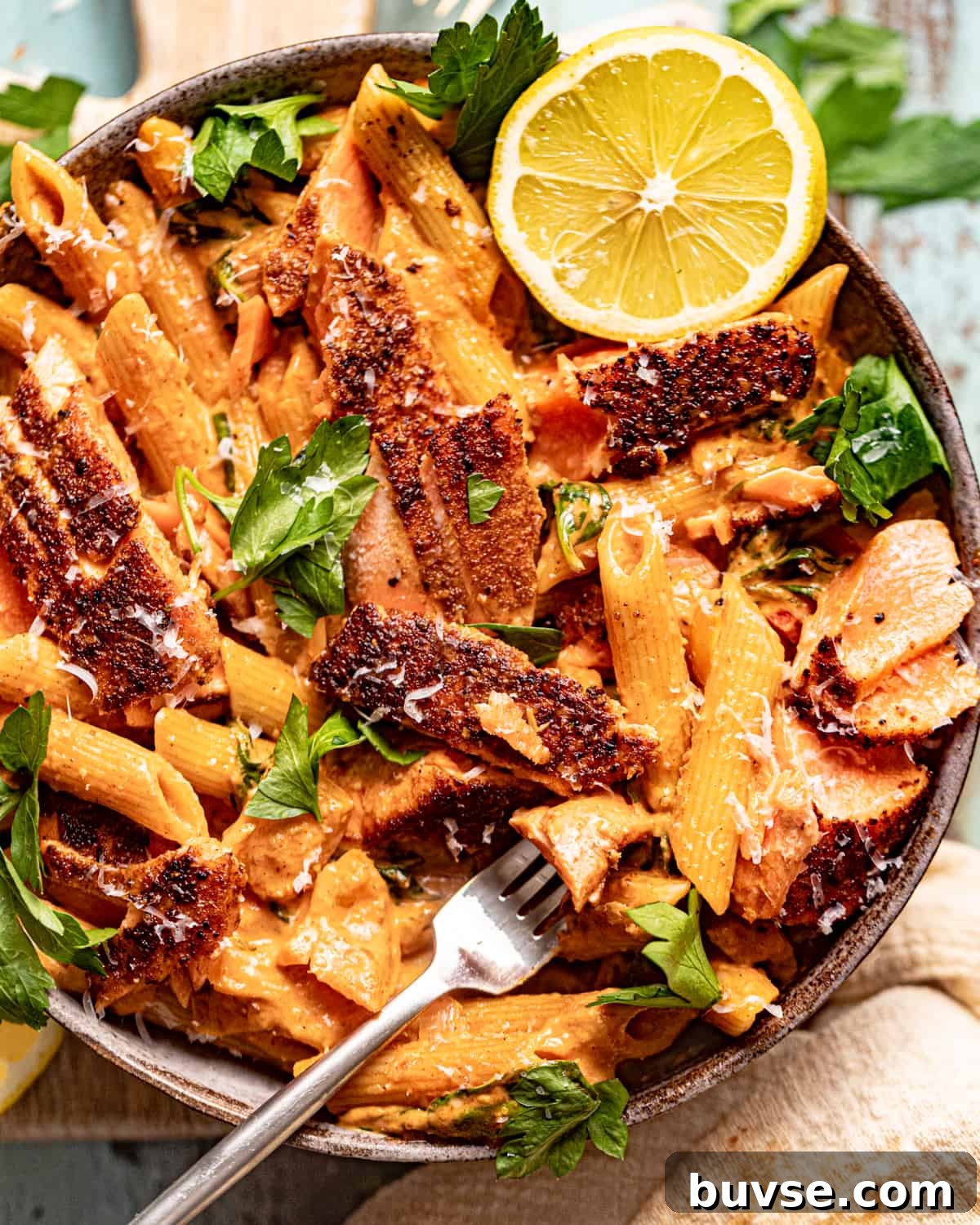 an up close photo of cajun salmon pasta.
