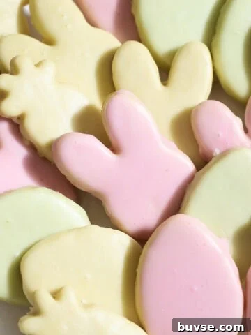 Iced cookies in a variety of colors on a platter.