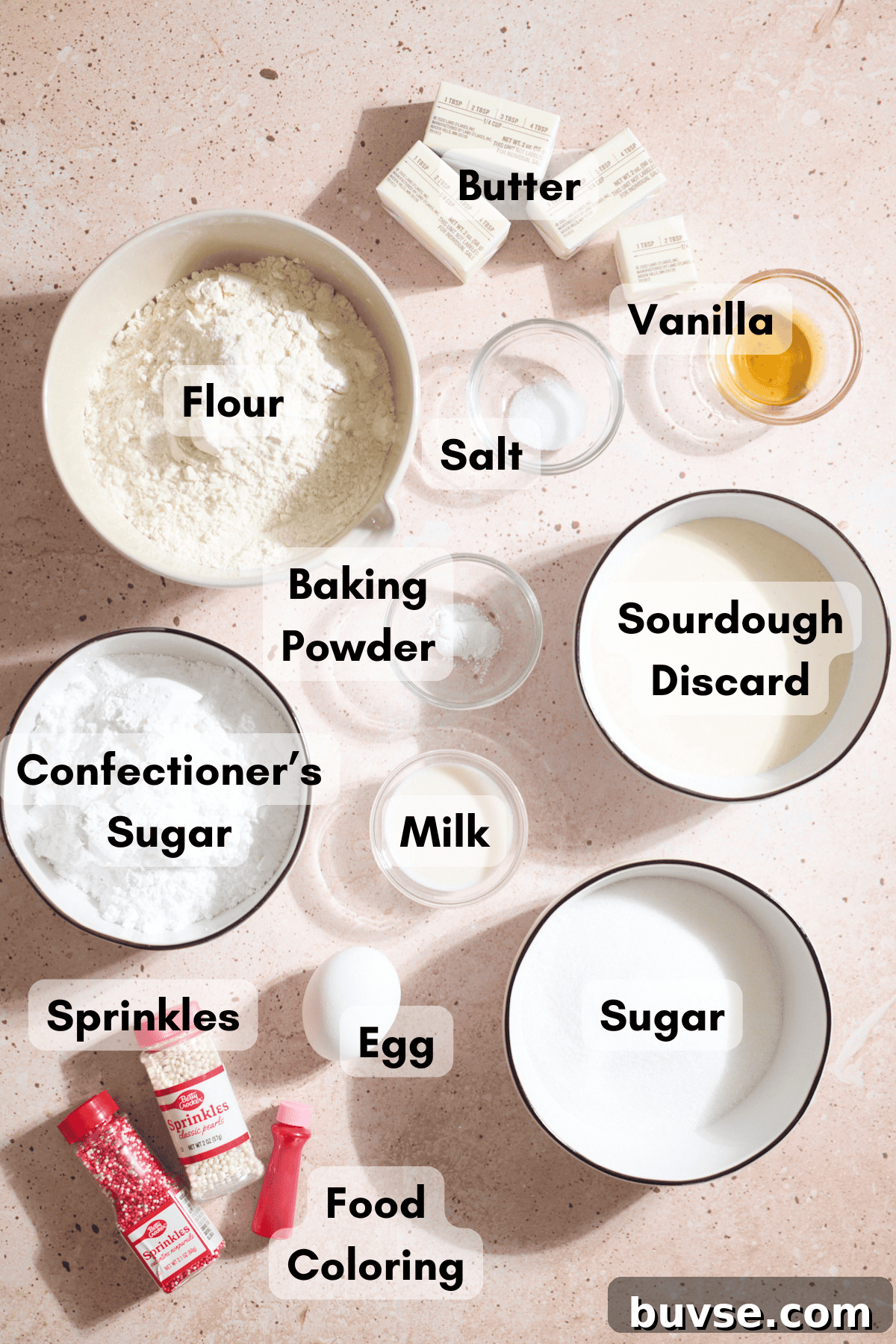 Ingredients for Sourdough Discard Sugar Cookie Bars in small bowls.