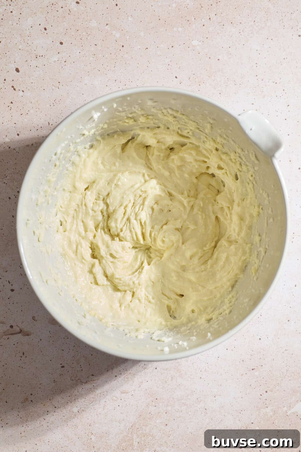 Wet ingredients mixed in a mixing bowl.