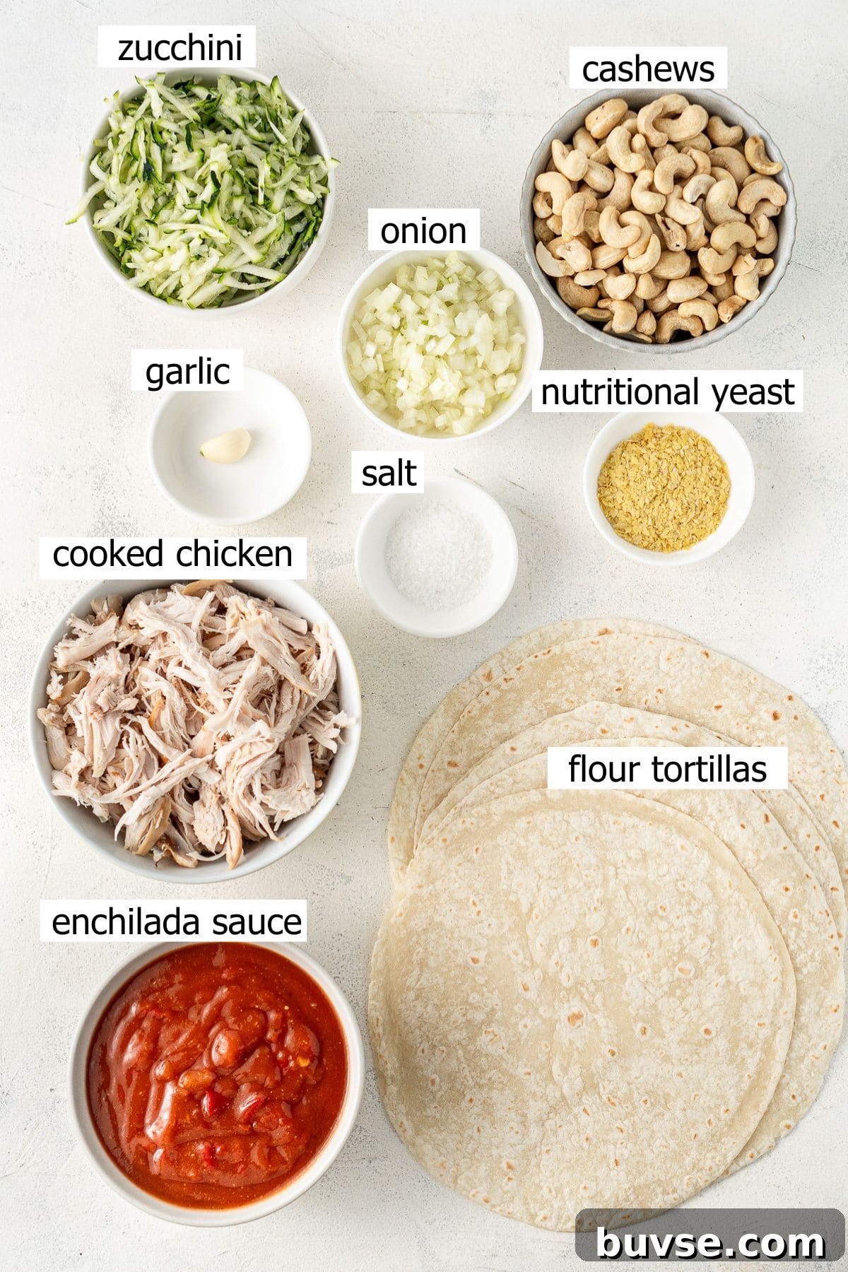 Flavorful Dairy-Free Chicken Enchiladas Recipe 3 All ingredients needed to make dairy free enchiladas laid out in bowls.