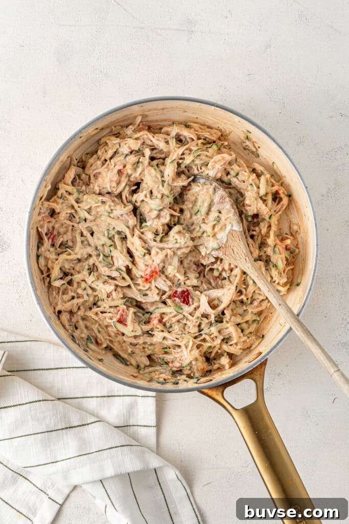 Flavorful Dairy-Free Chicken Enchiladas Recipe 8 The enchilada filling in a frying pan.