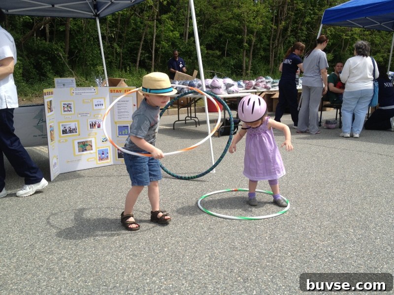 Children trying hula hoop