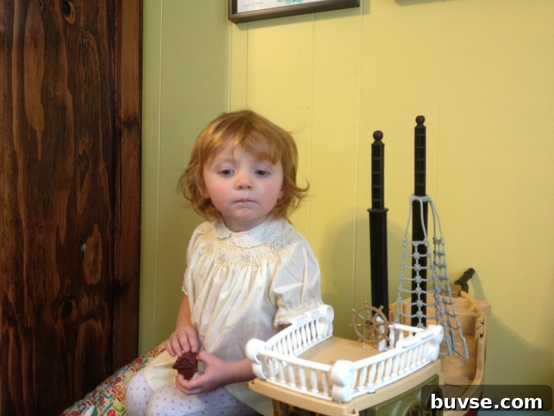 Child wearing a pirate hat thinking