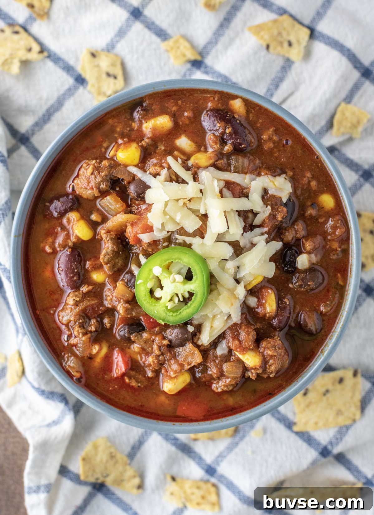 overhead shot of beef chili in blue bowl