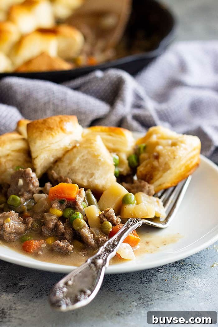 Pantry Recipes: Creative Shelf Cooking with Staples 22 This Easy Skillet Beef Pot Pie Recipe is the ultimate comfort food made easy! It's filled with vegetables in an easy homemade gravy and topped with biscuits. #potpie #groundbeef #easyrecipe #beefpotpie