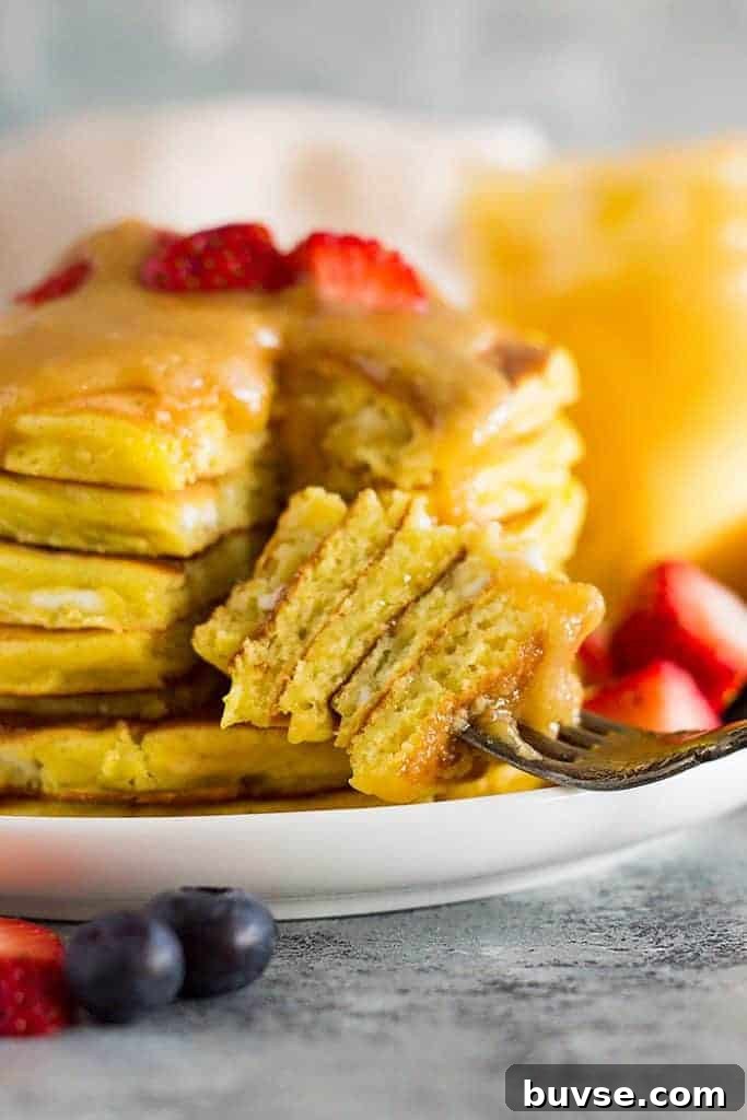 Pantry Recipes: Creative Shelf Cooking with Staples 8 A bite of high protein cottage cheese pancakes on a fork.