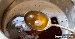 One-Bowl Brown Butter Mochi Banana Bread Recipe 13 A spoonful of brown butter.