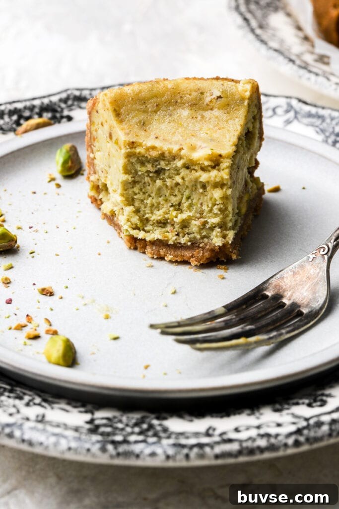 slice of cheesecake on a plate with a few bites taken out