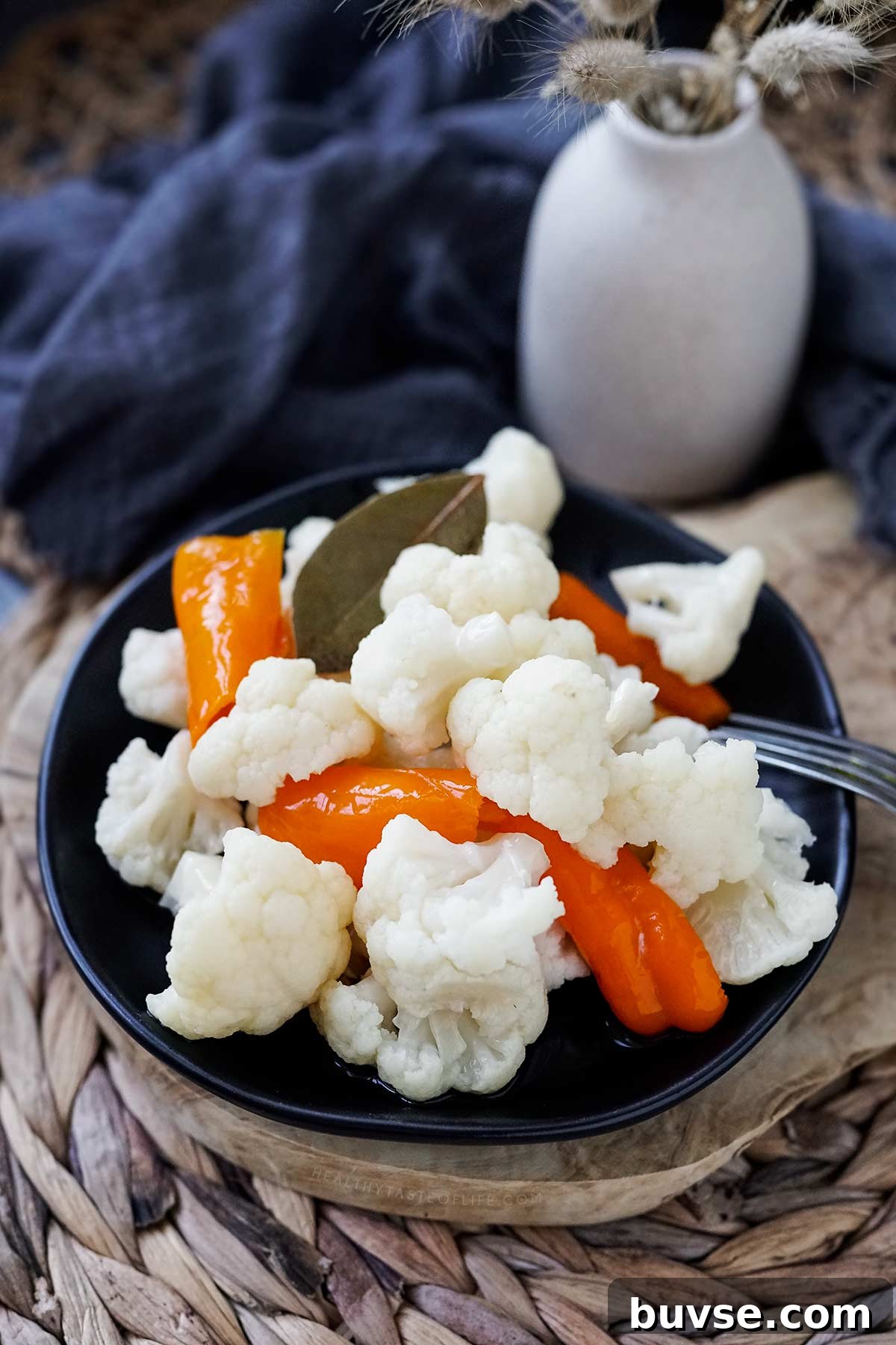 Lacto-Fermented Cauliflower Recipe: Tangy and Probiotic 2 Fermented cauliflower with sweet peppers on a plate.