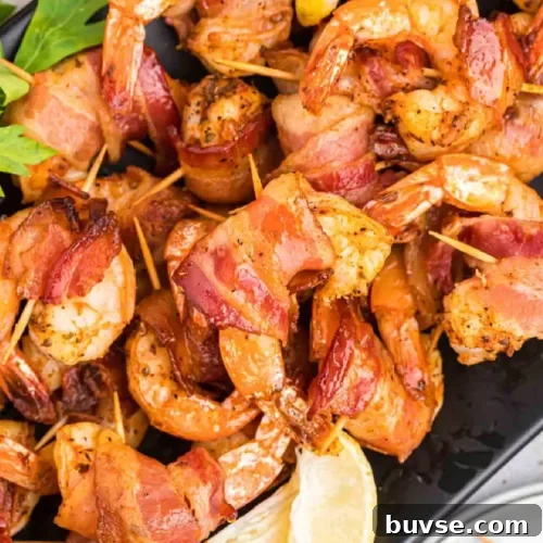 Leftover Shrimp Recipes: 12 Flavorful Ideas 14 Grilled Bacon wrapped shrimp stacked on a plate