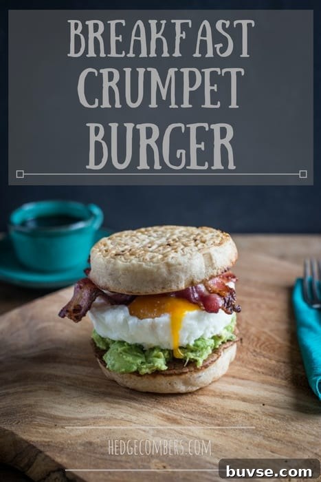 Breakfast Crumpet Burger on a wooden board with a knife and fork and a cup of coffee
