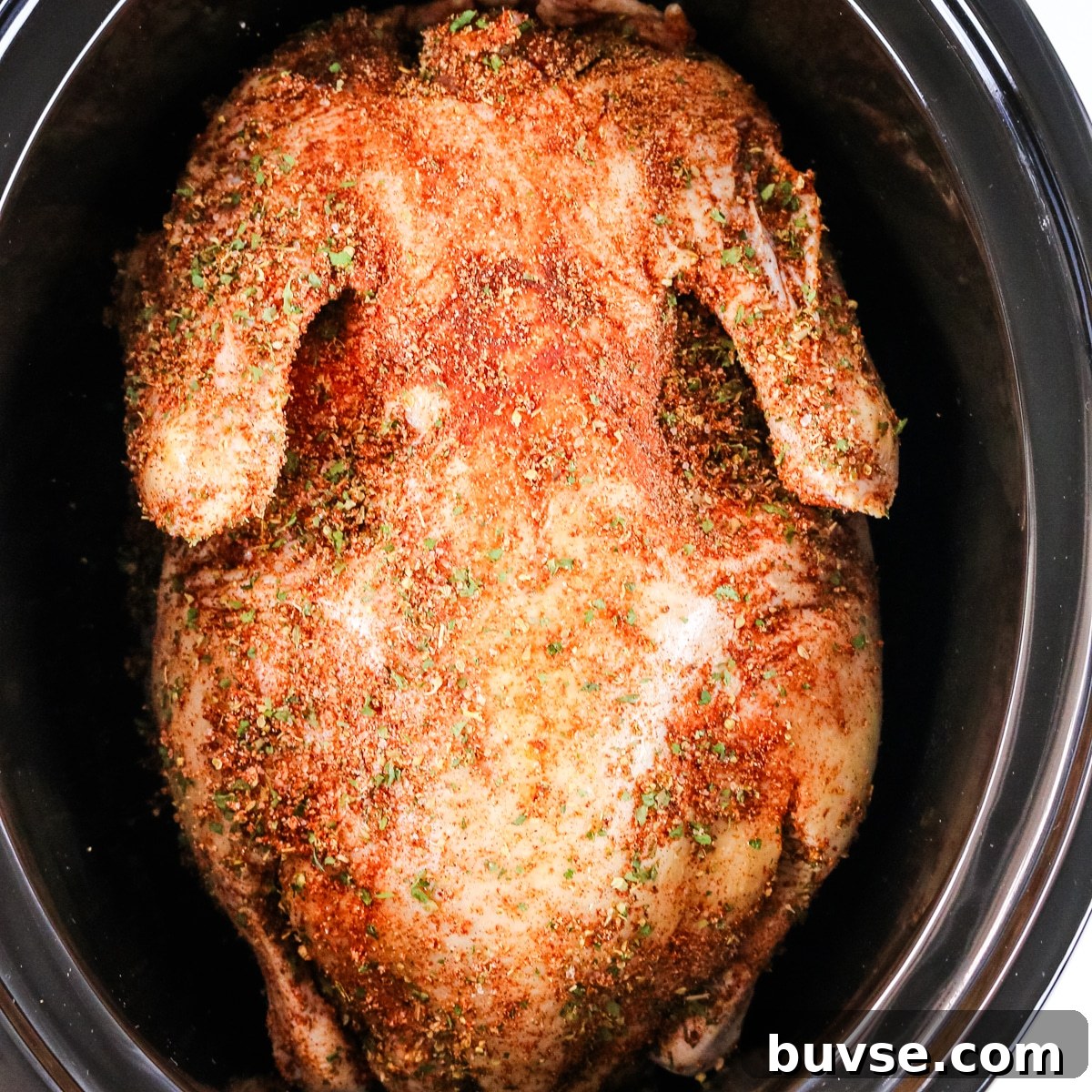 Slow Cooker Duck Recipe for Tender, Flavorful Meat 9 A duck seasoned with garlic in a slow cooker.