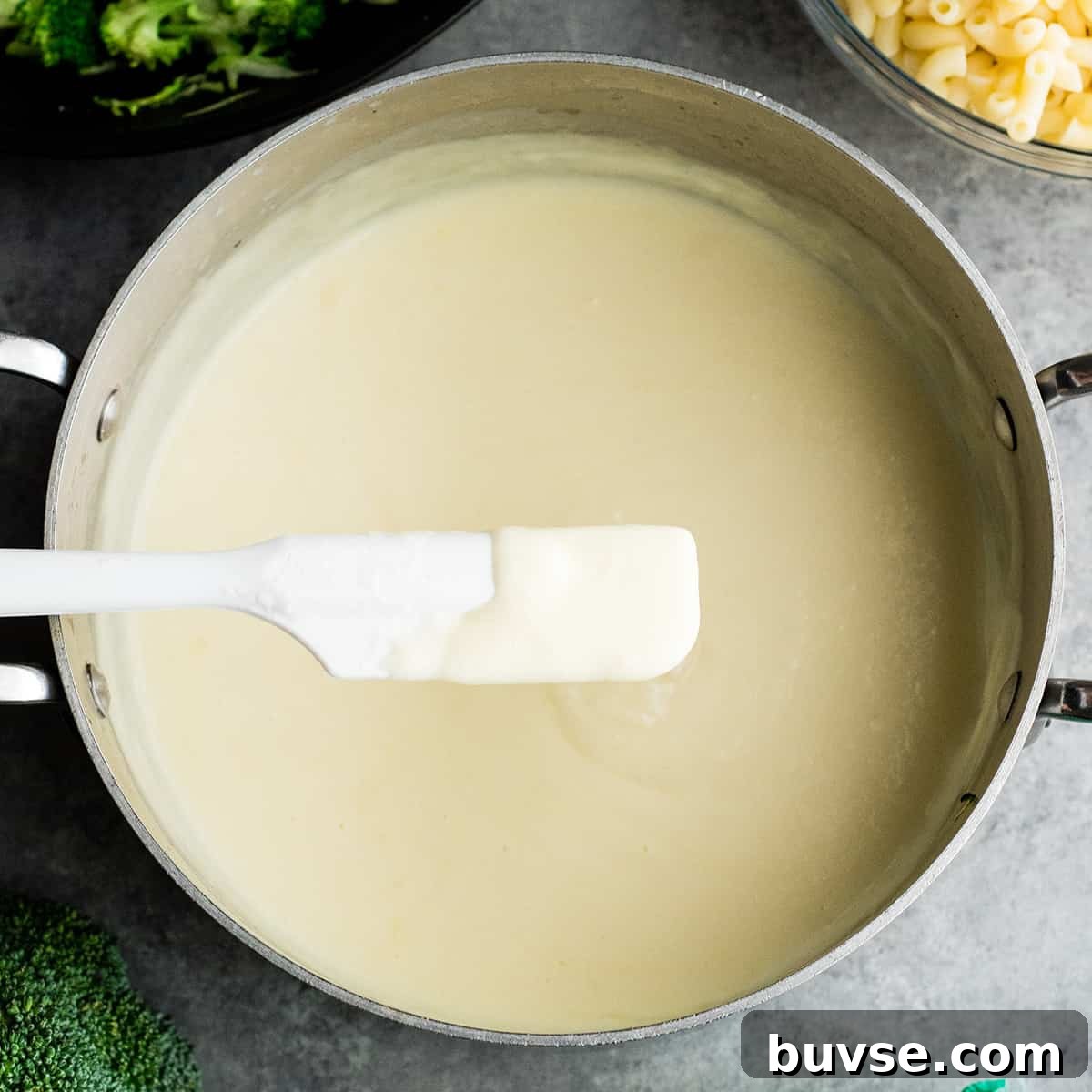 creamy cheese sauce in a saucepan