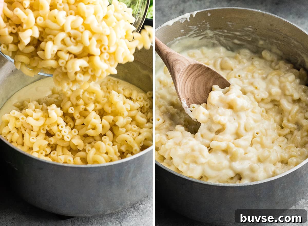 mixing pasta into cheese sauce