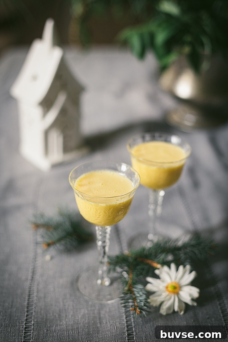 Zabaglione (Zabaione) Recipe: Classic Italian Egg Custard 5 soft grey and green christmas scene highlighting two pretty glasses of thick and frothy Zabione