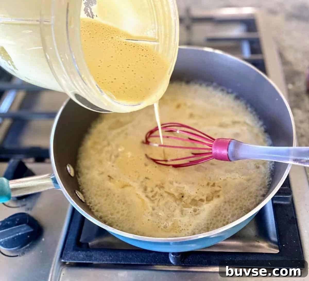Creamy Vegan White Sauce Lasagna Recipe 5 I am pouring the cashew mixture into the saute pan to make the white sauce lasagna.