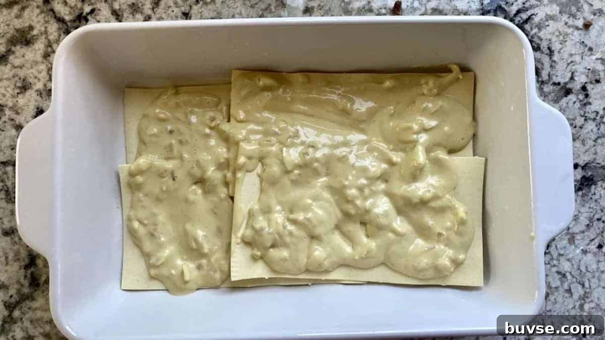 Creamy Vegan White Sauce Lasagna Recipe 7 Begin by layering sauce in the bottom of the pan and adding lasagna noodles.