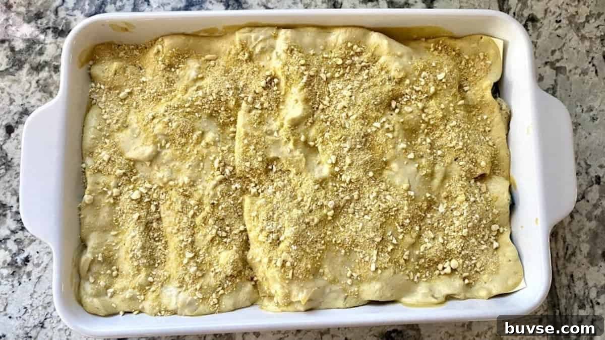 Creamy Vegan White Sauce Lasagna Recipe 9 Sprinkle the top of the vegan white sauce lasagna with vegan parmesan cheese.