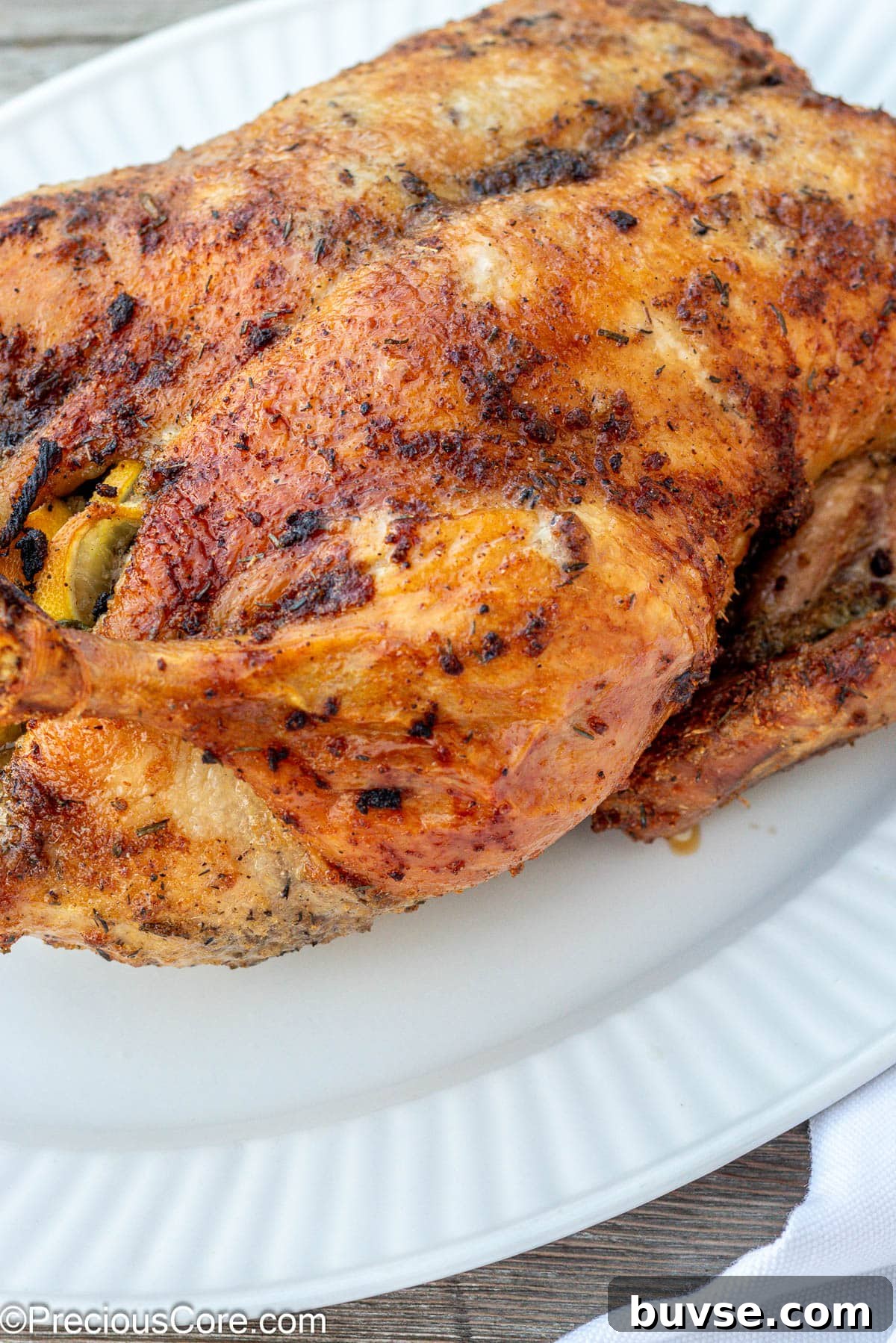 Herb Roasted Duck Recipe with Crispy Skin 2 Herb Roasted Duck on a white serving tray.