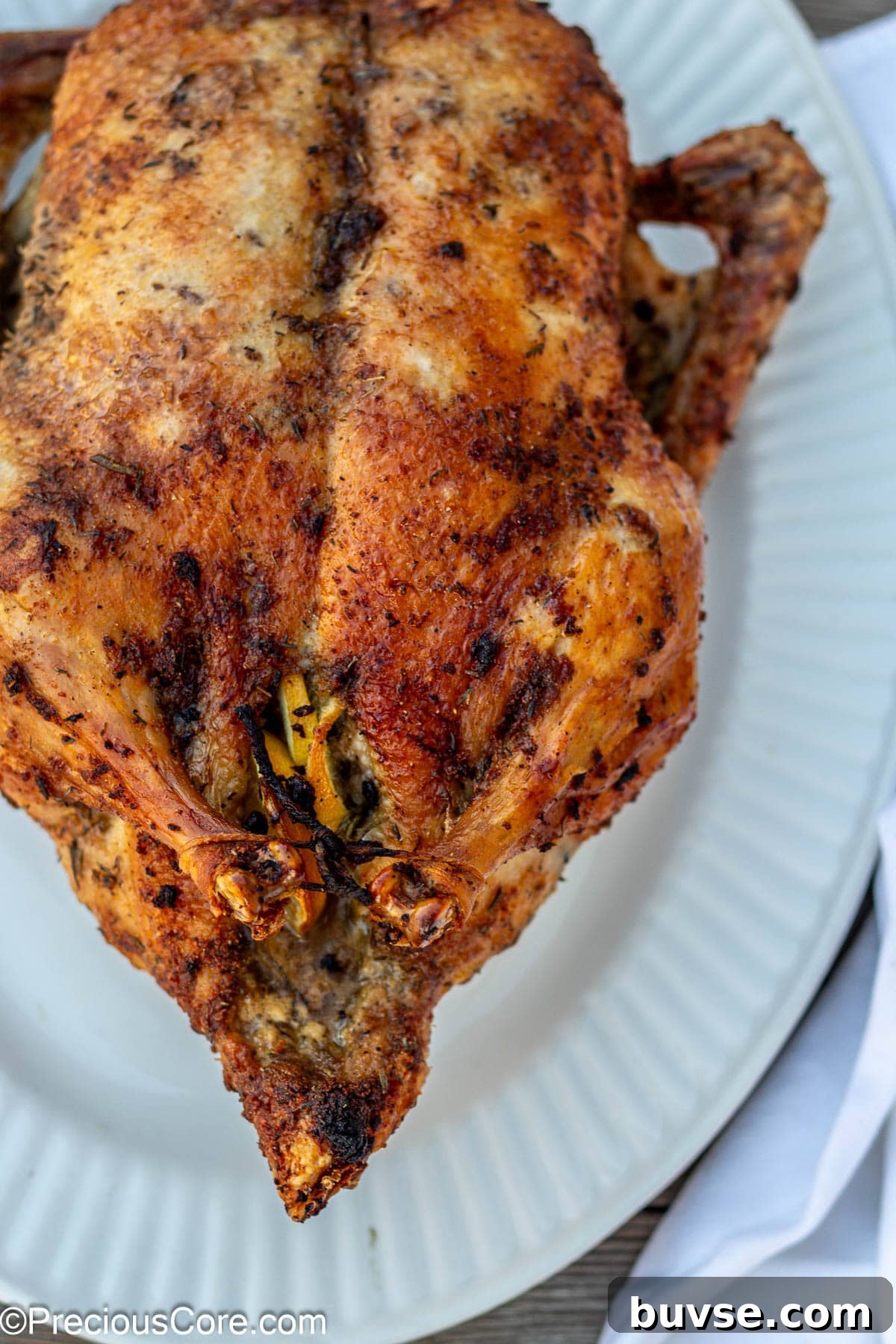 Herb Roasted Duck Recipe with Crispy Skin 7 Herb roasted duck on white tray.