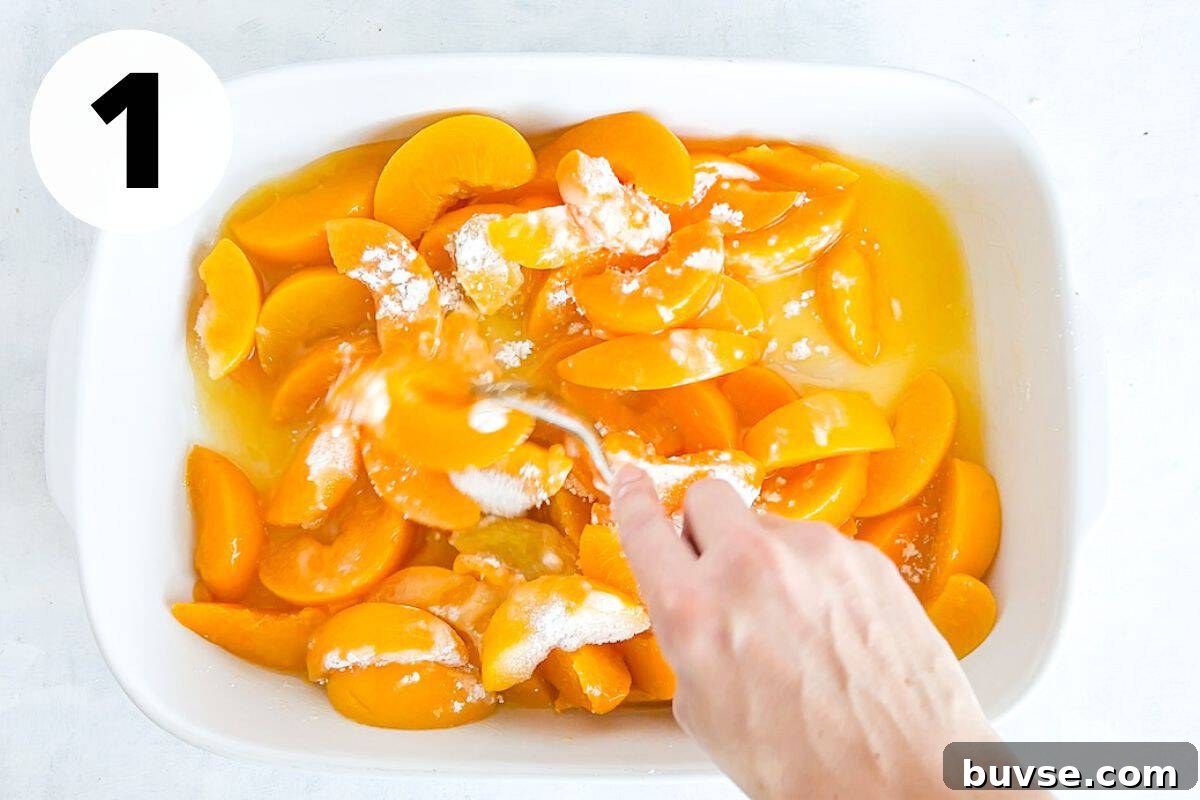 Quick Peach Cobbler with Canned Peaches and Cake Mix 4 peaches being mixed in baking dish.