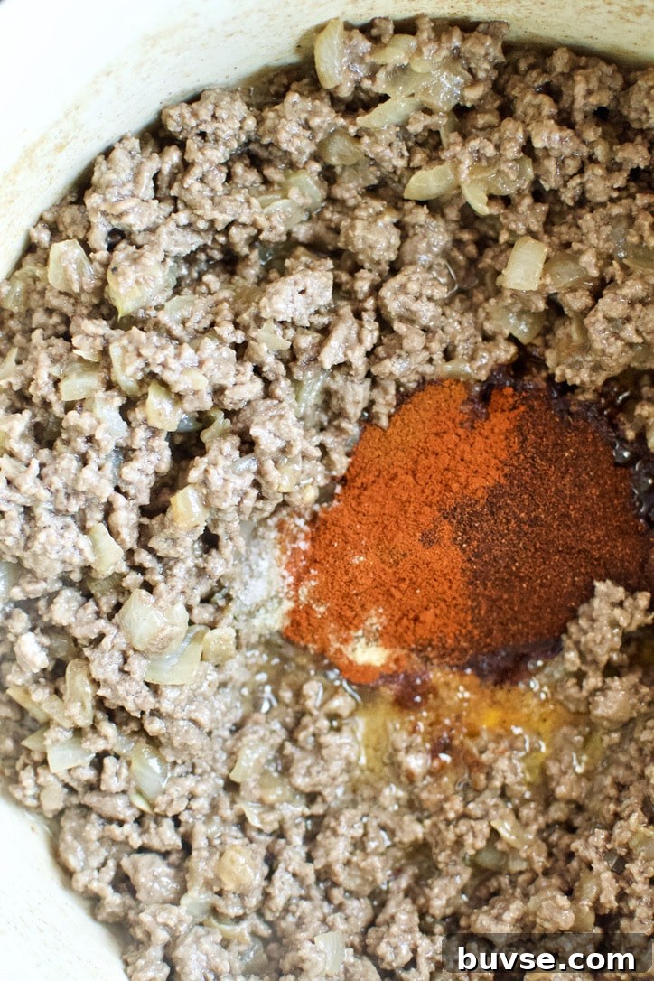 Chili spices add to the browned ground beef.